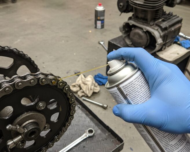 Motorcycle chain oil sprayed on the chain (photo)